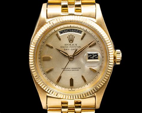 rolex oyster perpetual date gold and silver